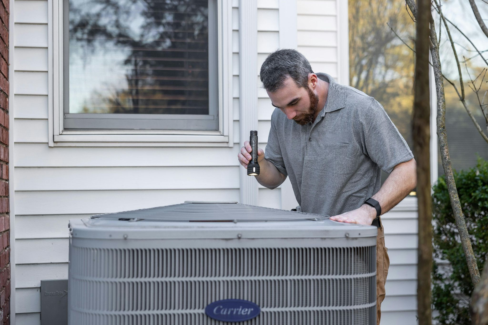 Contractor conducting HVAC maintenance